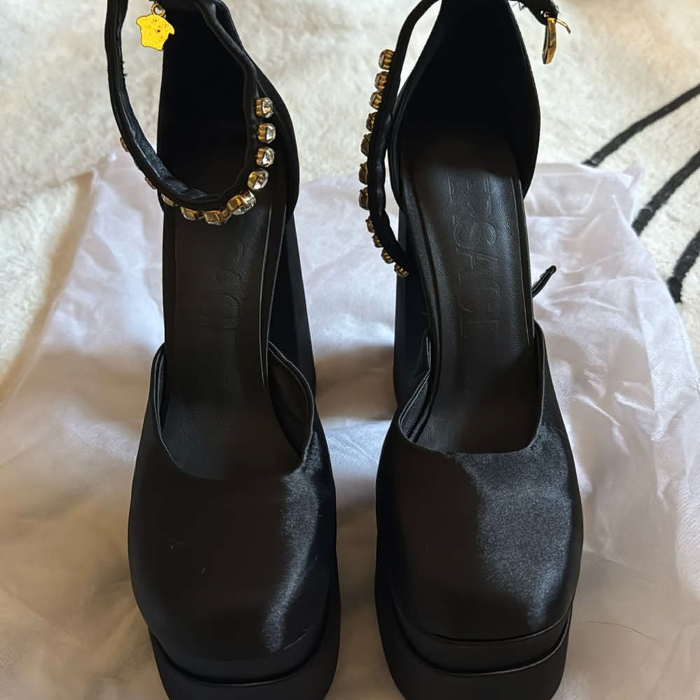 Versace stacked satin platform heels.